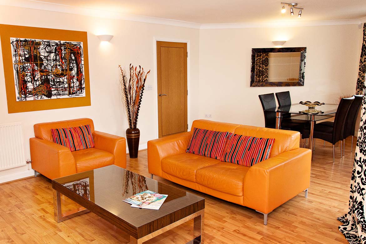 Lounge and diner, orange leather sofas